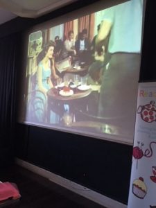 projected image of a beginning of Video about cafes